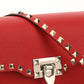 Small Rockstud Grainy Calfskin Crossbody Bag - Red