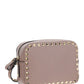 Small Rockstud Crossbody Bag in Grainy Calfskin Leather - Poudre