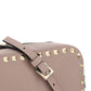 Small Rockstud Crossbody Bag in Grainy Calfskin Leather - Poudre