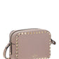 Small Rockstud Crossbody Bag in Grainy Calfskin Leather - Poudre
