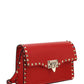 Small Rockstud Grainy Calfskin Crossbody Bag - Red